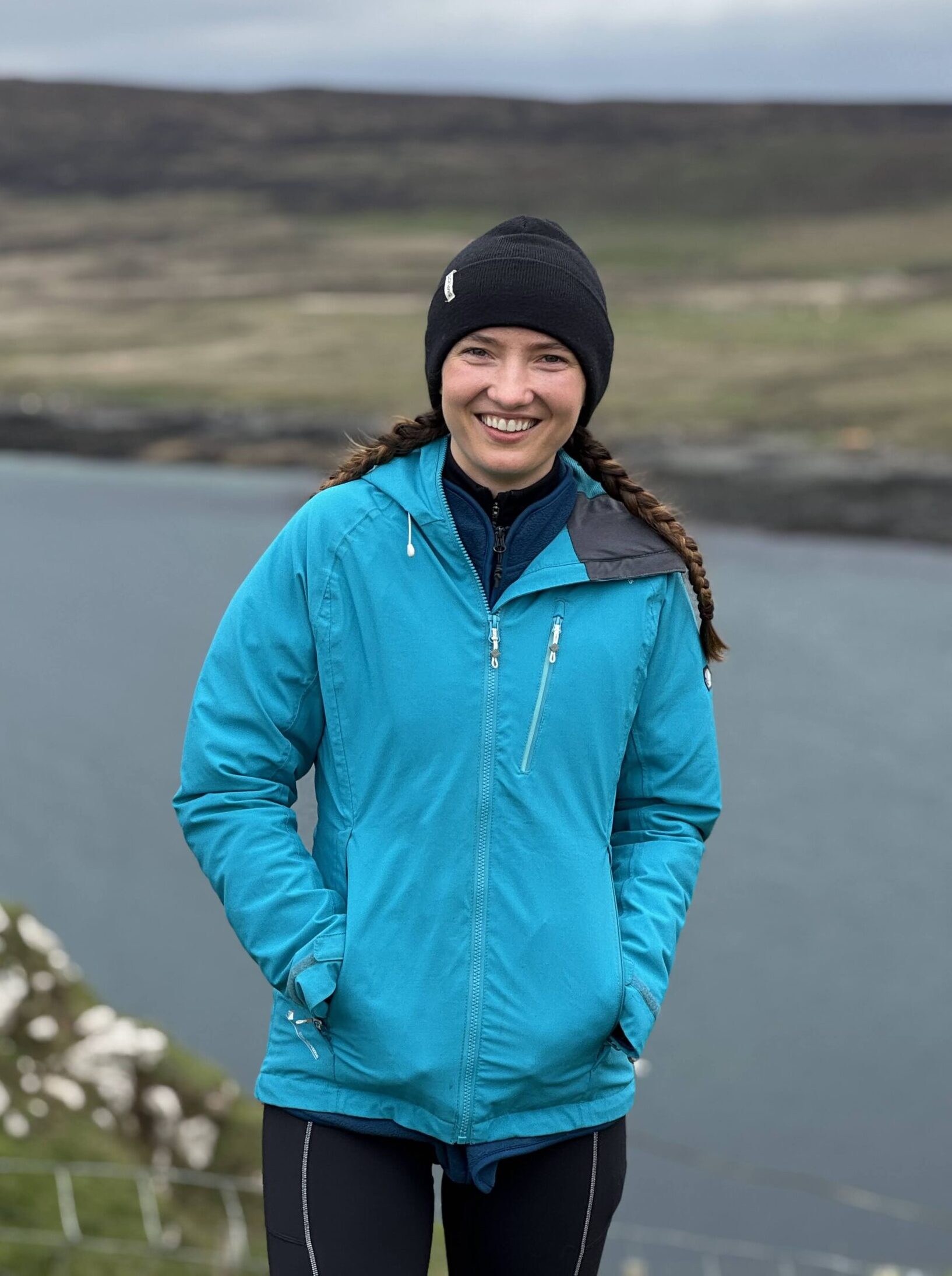 woman smiling, hiking apparel, Scotland travel.